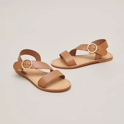 Asymmetrical sandals in camel leather