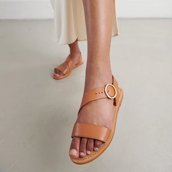 Asymmetrical sandals in camel leather