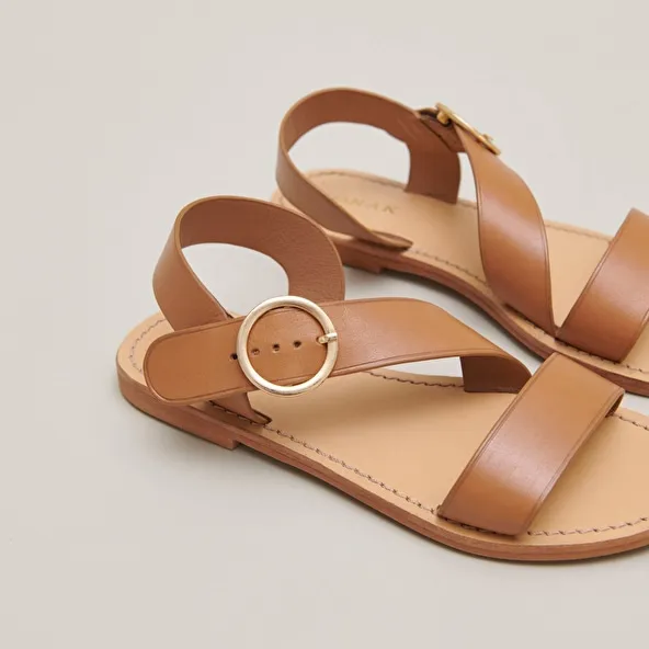 Asymmetrical sandals in camel leather