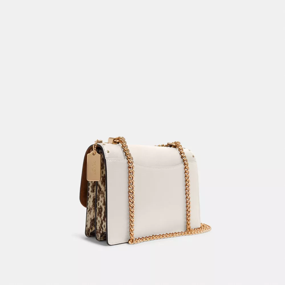 Klare Crossbody Bag In Signature Canvas With Rivets